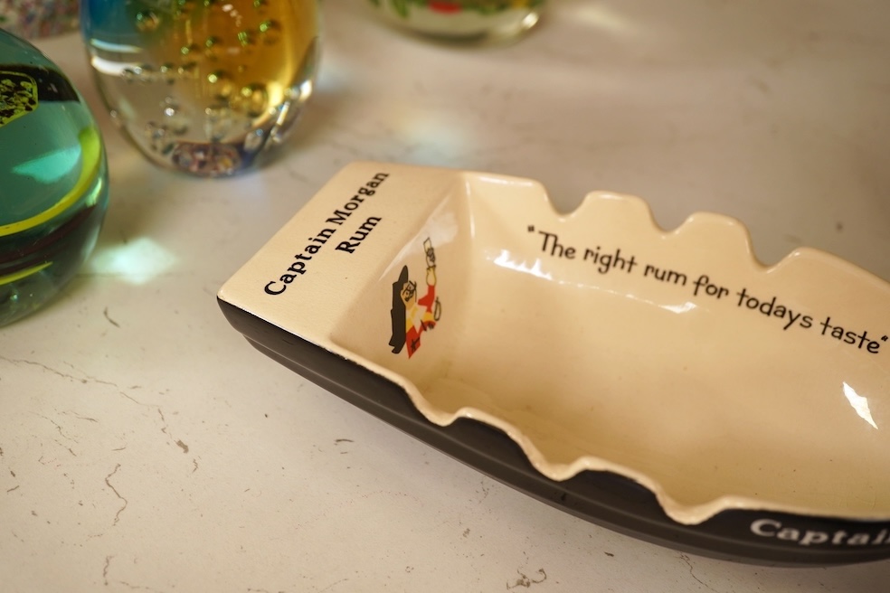 Wade 'Purser's Navy Rum Decanter' and two Captain Morgan rum boat ashtrays, decanter 24cm high